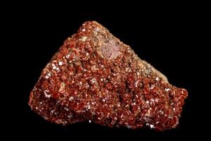 Macro mineral stone Vanadinite on a black background photo