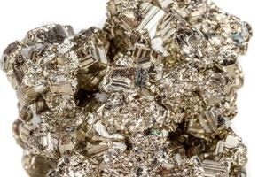 Macro mineral stone Pyrite gold on white background photo