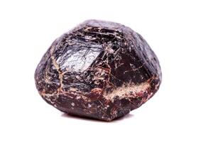 Macro of a mineral garnet stone on a white background photo