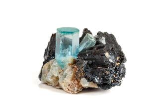 Macro mineral stone Aquamarine and black tourmaline, Schorl on a white background photo