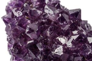 Macro mineral stone Amethysts eye crystals on white background photo