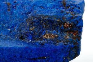 Macro Azurite mineral stone with Pyrite inserts on a white background photo