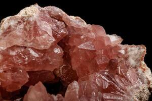 Macro mineral stone Pink Amethyst on a black background photo