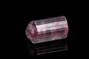 macro mineral tourmaline stone on black background photo