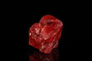 Macro mineral spinel stone on black background photo