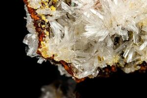 Macro mineral stone crystals Hemimorphite rock on a black background photo