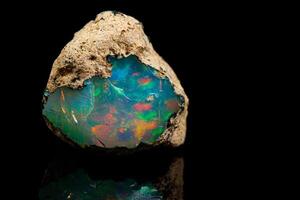 macro mineral stone rare and beautiful opals on a black background photo