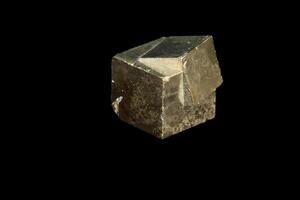 Macro mineral stone Pyrite on a black background photo