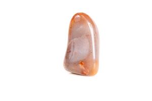 Macro mineral stone Carnelian on white background photo