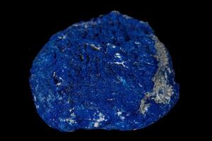 Macro mineral stone Azurite in siltstone against black background photo