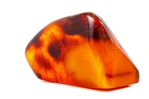 Macro Amber mineral stone on white background photo