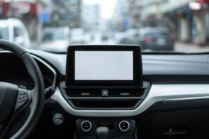 Close-up of a modern vehicle's dashboard featuring a blank infotainment screen, with a blurred street in the background photo