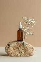 cosmetic bottle with pipettele podium with flowers on stone and beige background photo