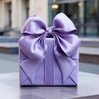 Purple gift box with bow on the table. Valentine's day greeting card photo