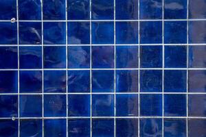 dark blue tile wall, abstract pattern mosaic background, textured wall or floor photo