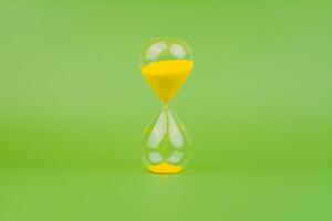 Hourglass, colorful countdown, time limit, time concept and importance of spending time. photo