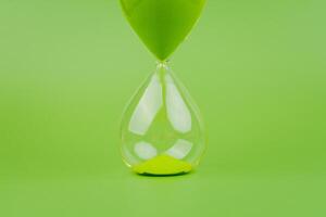 Hourglass, colorful countdown, time limit, time concept and importance of spending time. photo