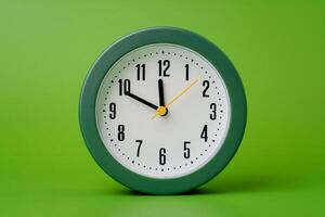 Modern alarm clock ticking, standing still time, time concept, time photography in studio. photo