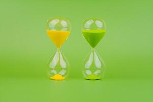 Hourglass, colorful countdown, time limit, time concept and importance of spending time. photo