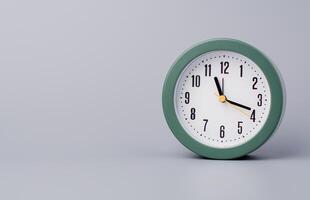 Modern alarm clock ticking, standing still time, time concept, time photography in studio. photo