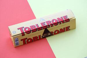 KYIV, UKRAINE - OCTOBER 31, 2023 Yellow Toblerone Chocolate Bar. Toblerone originated in Switzerland around 1908 photo