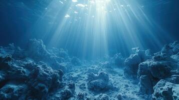 The suns rays illuminate the water over a vibrant coral reef photo