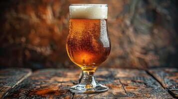 A glass of beer placed on a rustic wooden table photo