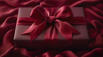 A gift box wrapped with a red ribbon photo