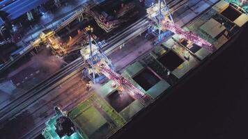 AERIAL Closed loading of coal on a large cargo ship at a modern coal terminal video