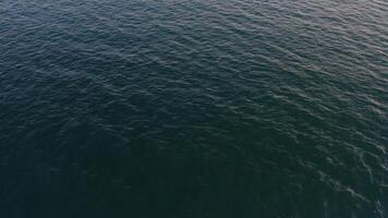 Island with high vertical rocks among the sea video