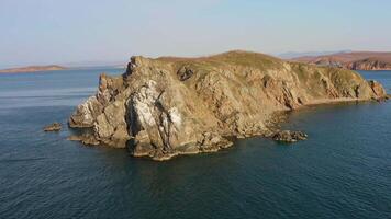 Island with high vertical rocks among the sea. Nesting place for seabirds video