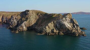 Island with high vertical rocks among the sea. Nesting place for seabirds video