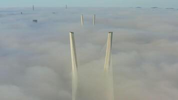 Tops of the pylons of the Golden Bridge in the dawn fog video
