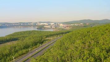 A modern complex of buildings on the shore of the bay surrounded by a large park video