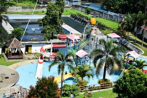 February 29, 2024. Magelang, Indonesia. playful, laughing, and enjoy kids in water park photo