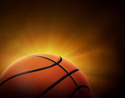 basketball ball. on black background with smoke, yellow orange red white colored back lights photo