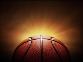 pelota de baloncesto. sobre fondo negro con humo, luces traseras de color amarillo naranja rojo blanco foto