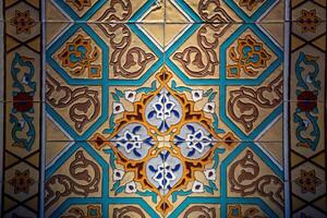 Geometric traditional Islamic ornament. Fragment of a ceramic mosaic. photo