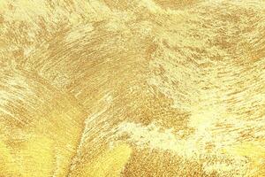 Texture of golden decorative plaster or concrete. Abstract gold grunge background. photo