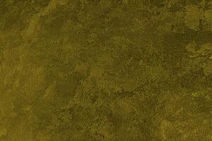 Texture of golden decorative plaster or concrete. Abstract gold grunge background. photo