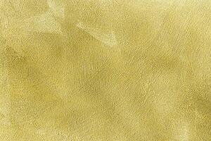 Texture of golden decorative plaster or concrete. Abstract gold grunge background. photo