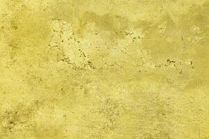 Texture of golden decorative plaster or concrete. Abstract gold grunge background. photo