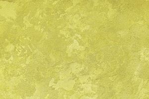 Texture of golden decorative plaster or concrete. Abstract gold grunge background. photo