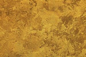 Texture of golden decorative plaster or concrete. Abstract gold grunge background. photo