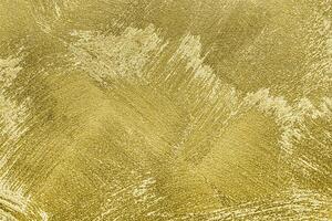 Texture of golden decorative plaster or concrete. Abstract gold grunge background. photo