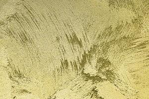 Texture of golden decorative plaster or concrete. Abstract gold grunge background. photo