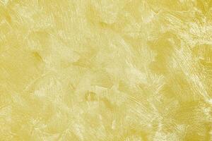 Texture of golden decorative plaster or concrete. Abstract gold grunge background. photo