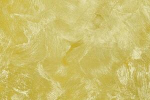 Texture of golden decorative plaster or concrete. Abstract gold grunge background. photo