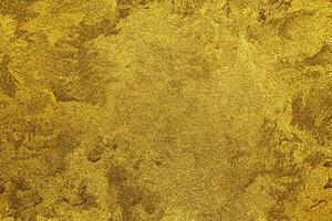 Texture of golden decorative plaster or concrete. Abstract gold grunge background. photo