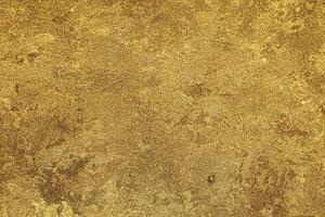 Texture of golden decorative plaster or concrete. Abstract gold grunge background. photo